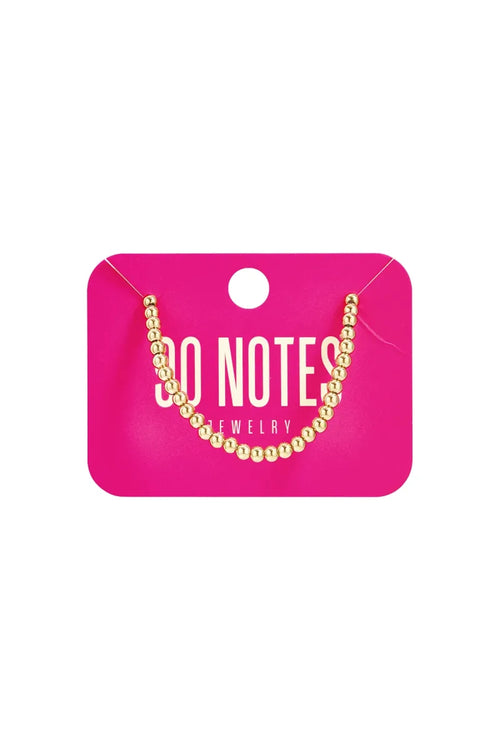  90 NOTES - 4mm kralen armband - goud