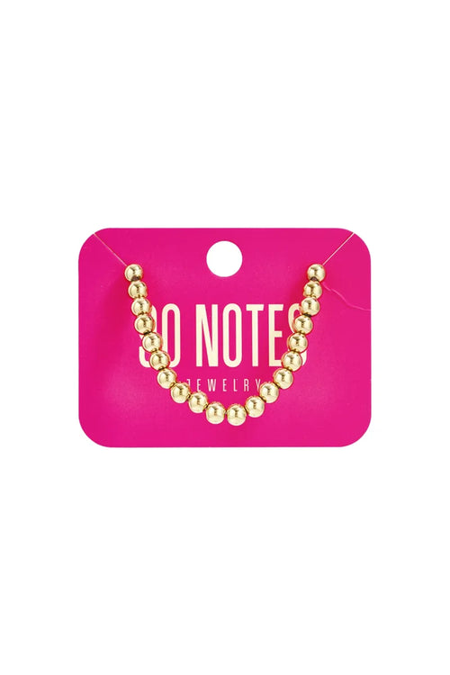  90 NOTES - 6mm kralen armband - goud