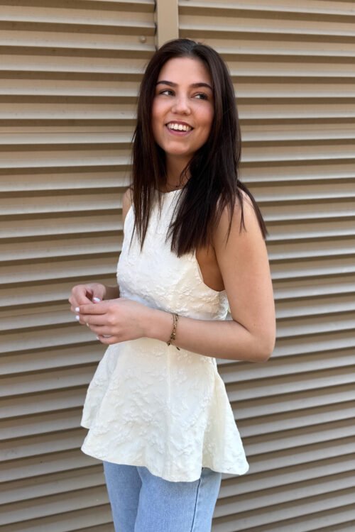 Ecru peplum top met open rug