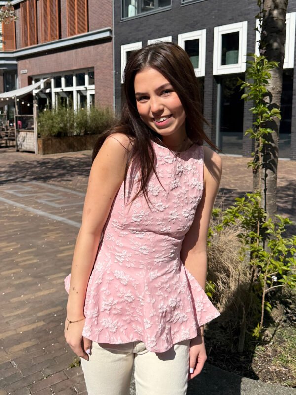 Roze peplum top met open rug