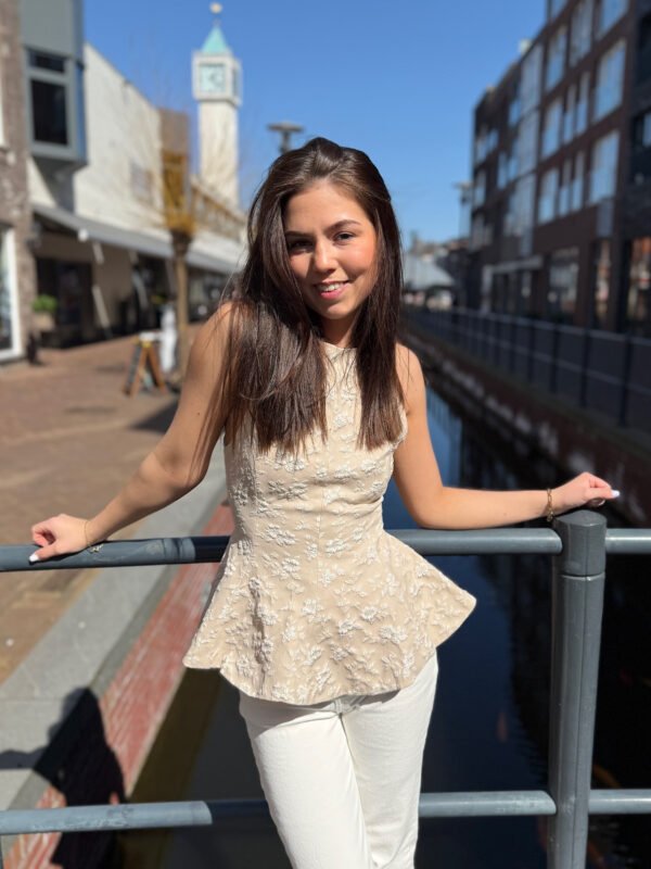 Taupe peplum top met open rug