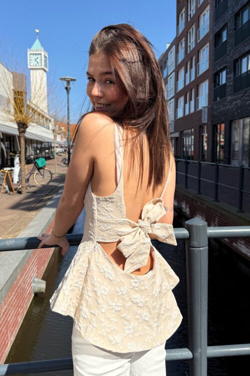Taupe peplum top met open rug