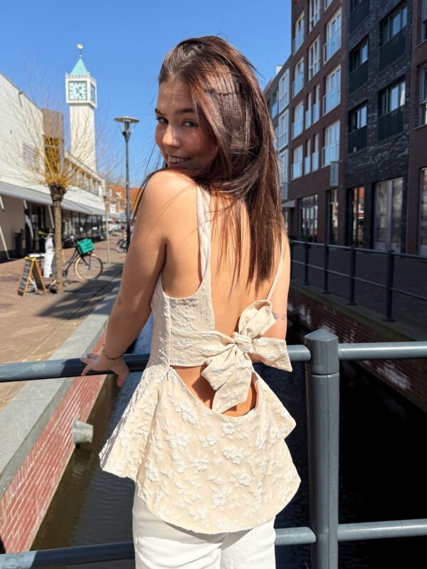 Taupe peplum top met open rug