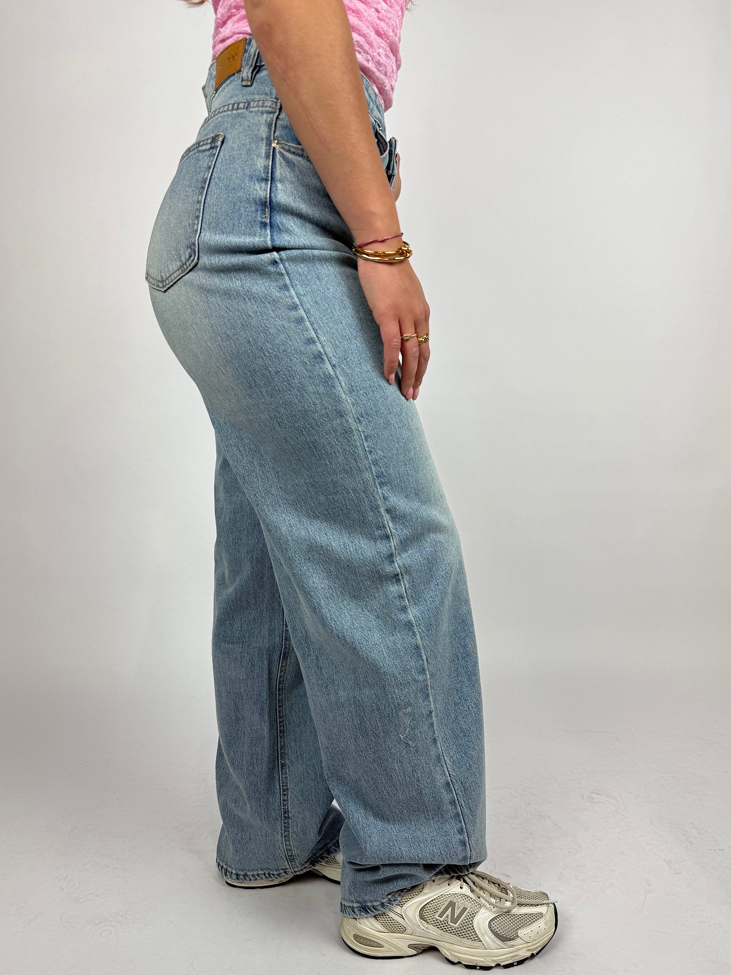 Blauwe jeans met asymmetrische sluiting 3390